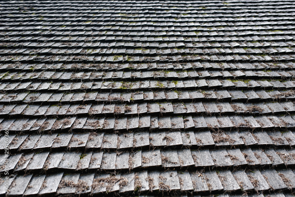 Old roof made of gray wooden planks. Backgrounds and textures Old roof made of gray wooden planks. Backgrounds and textures