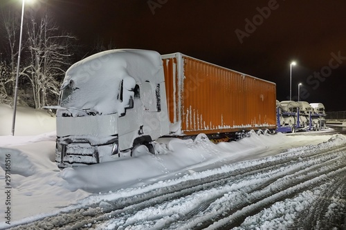Truck stuck in snow ba a highway after big snowfall photo