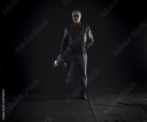 Quadro em tela full-length biker on a black background