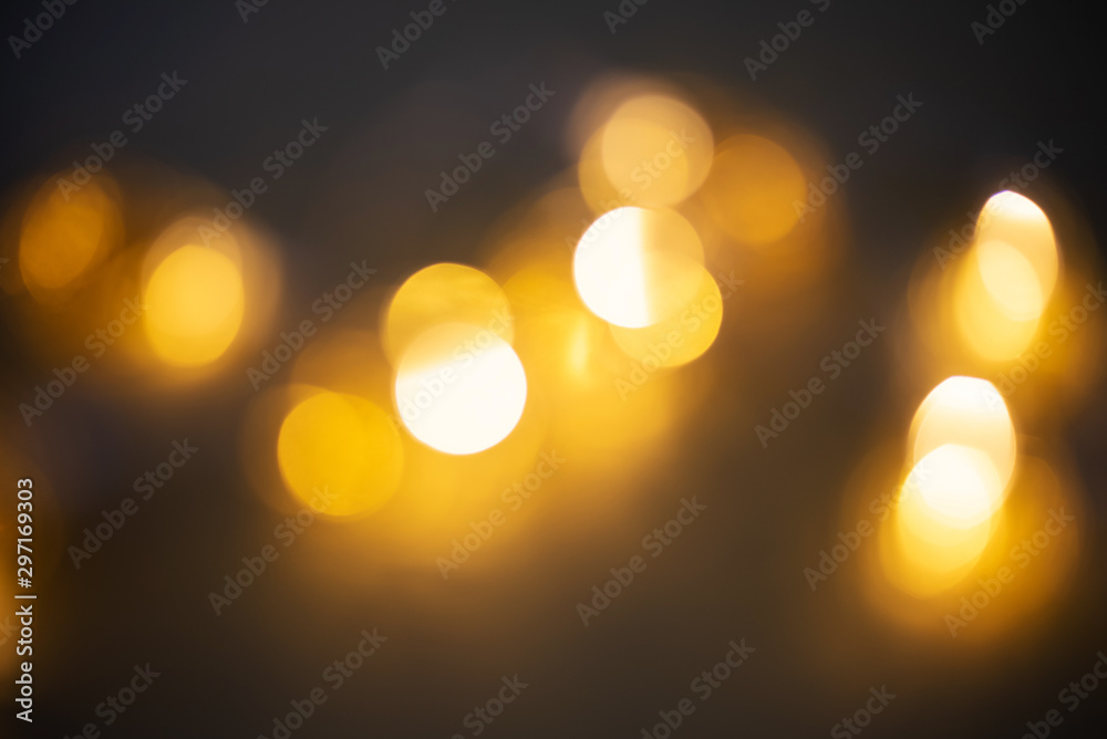 Blurred garland light. Golden bokeh on black background,blurred garland light Blurred garland light. Golden bokeh on black background,blurred garland light