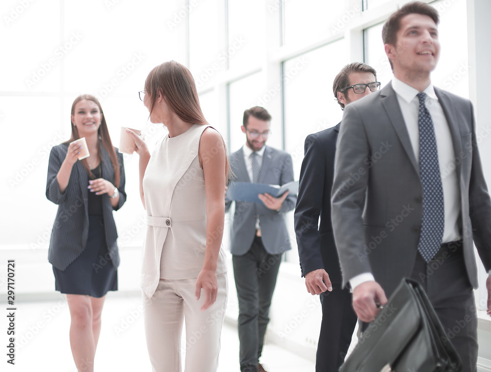 employees in the office corridor during the working day