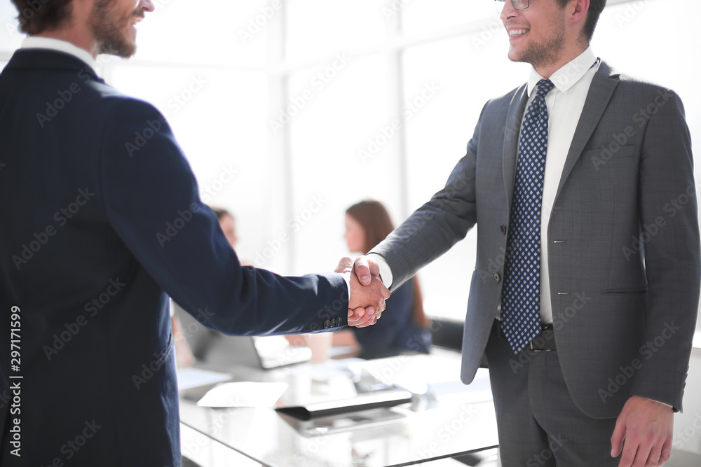 reliable handshake of business partners in the office reliable handshake of business partners in the office
