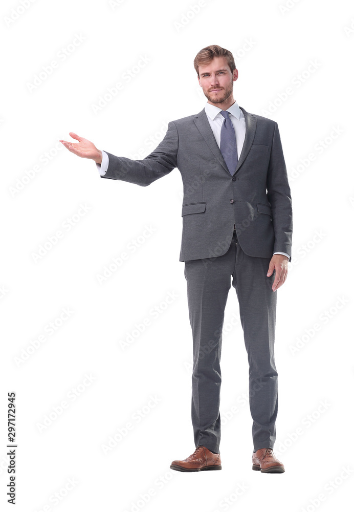 in full growth. businessman with a hand in a welcoming gesture. in full growth. businessman with a hand in a welcoming gesture.