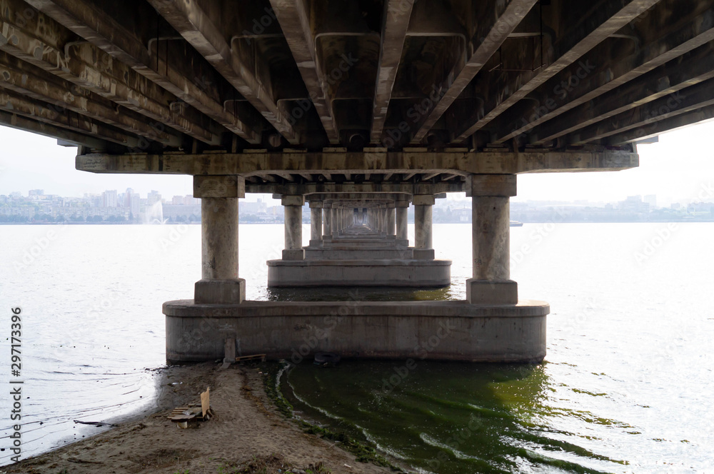 Gallery of the columns of the bridge. Under the bridge over the river. Gallery of the columns of the bridge. Under the bridge over the river.
