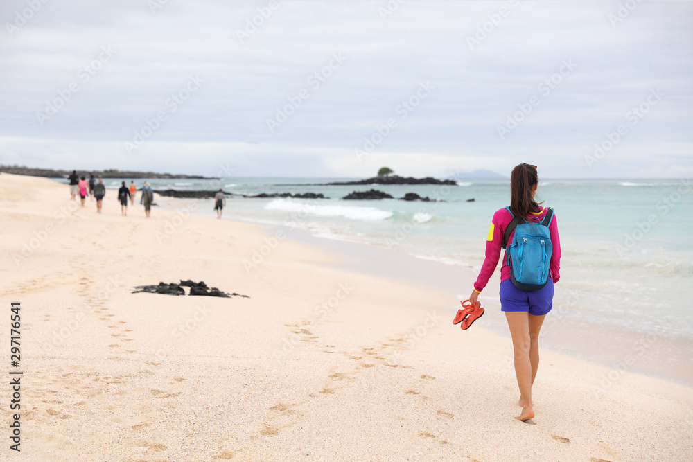 Galapagos Islands - woman on cruise ship tour visiting Playa las Bachas  Beach on Santa Cruz Island. Woman walking barefoot in sand enjoying  pristine nature landscape ecotourism Stock Photo | Adobe Stock