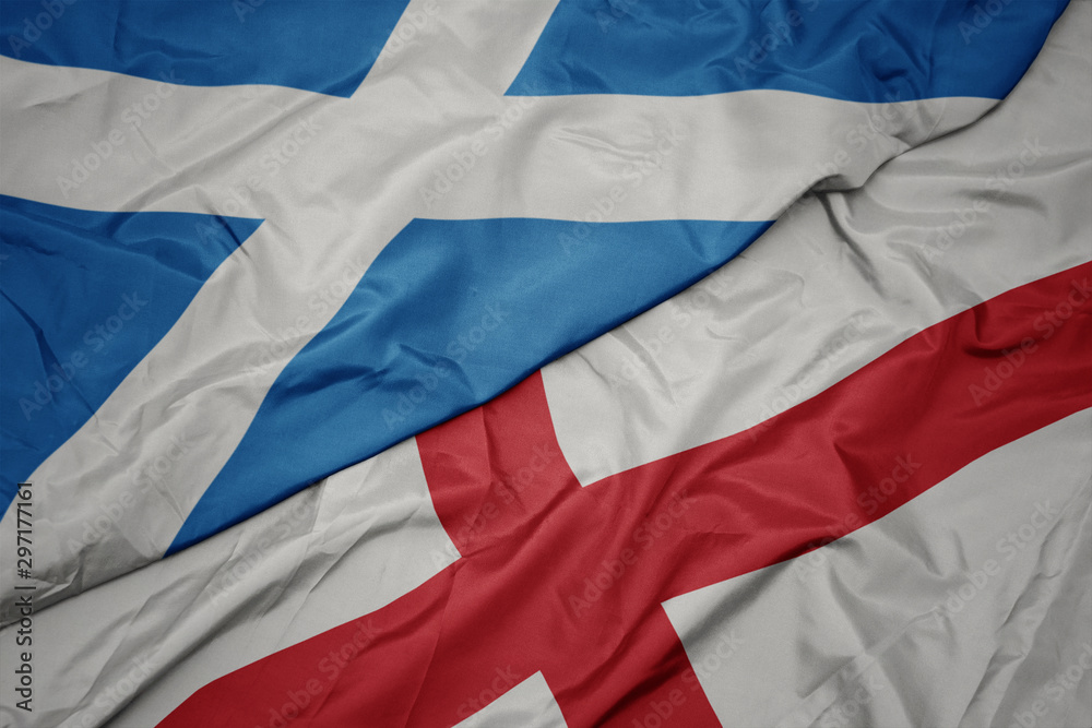 waving colorful flag of england and national flag of scotland. waving colorful flag of england and national flag of scotland.