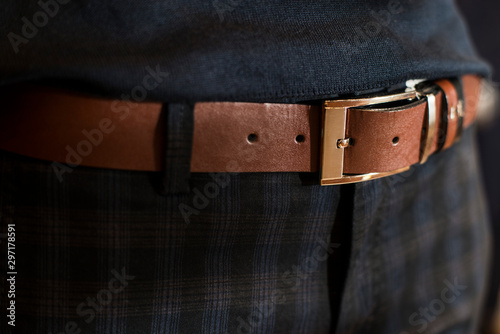 Brown leather men 's belt in trousers