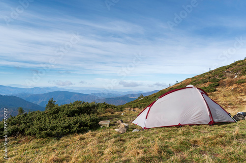 Tourist tent in the mountains. Tourists in the mountains. photo