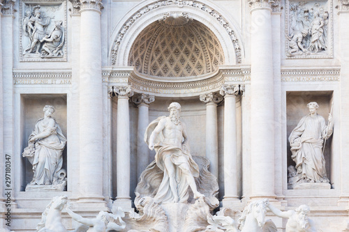 Famous landmark fountain di Trevi details in Rome, Italy during summer sunny day.