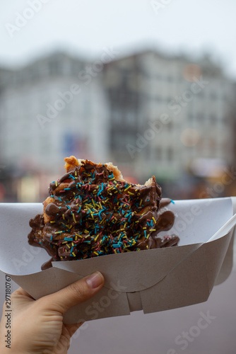 Photography waffles with chocolate in their hands, Dutch waffles with confetti in their hand