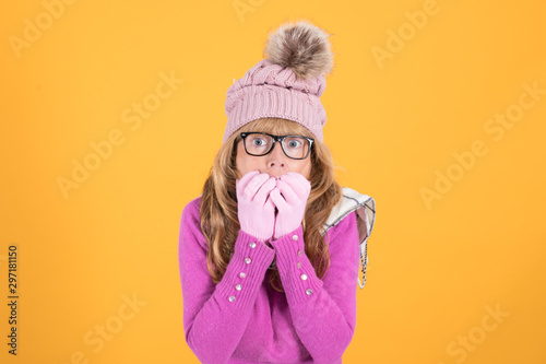 woman with expression of surprise or fear isolated on color background