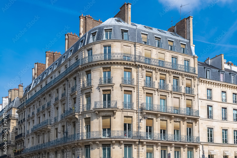 Paris, parisian facade in a chic area, typical balcony and windows