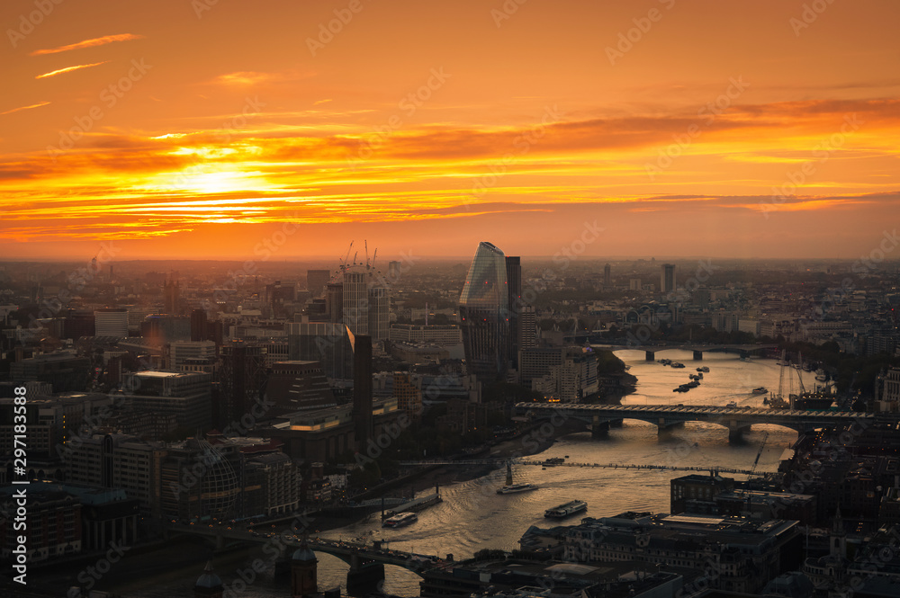 View at  London and busy Thames river during sunset.