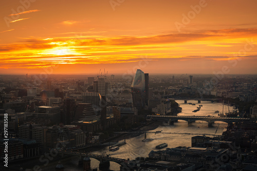 View at  London and busy Thames river during sunset.
