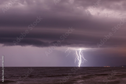 storm cloud and lightning over sea