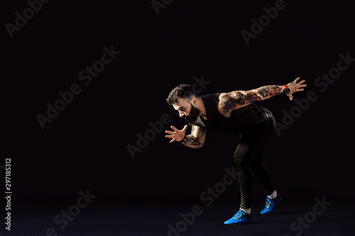 One caucasian man young sprinter runner running in silhouette studio on dark background. Isolate © zamuruev