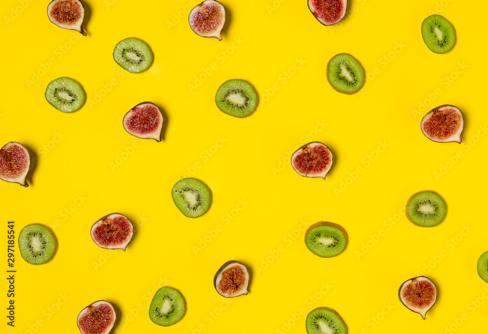 Figs and kiwi patterns isolated on yellow background Figs and kiwi patterns isolated on yellow background