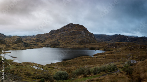 View from “La Toreadora” inside El Cajas National Park. You can see many lagoons, rocky mountains and low vegetation in the distance. A wet and foggy weather, typical of wastelands. Azuay, Ecuador © Pajaros Volando