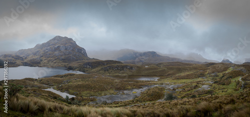 View from    La Toreadora    inside El Cajas National Park. You can see many lagoons  rocky mountains and low vegetation in the distance. A wet and foggy weather  typical of wastelands. Azuay  Ecuador