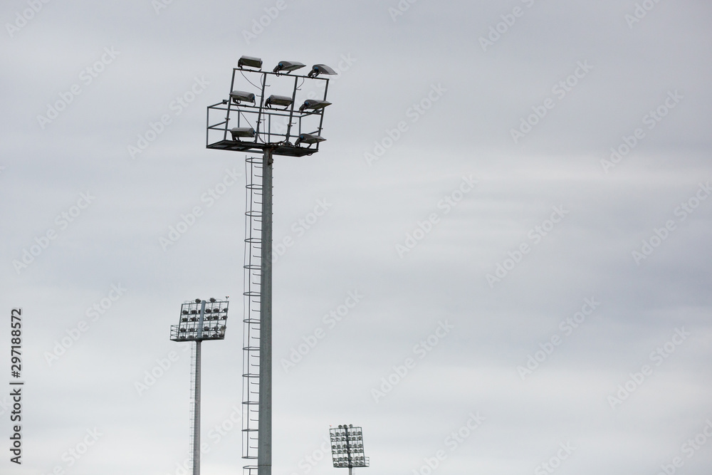 Obraz premium Sports stadium light tower during the day