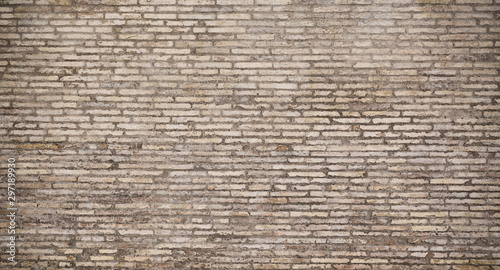 Old gray brick wall texture background. Vintage grunge architecture or interior design abstract texture.