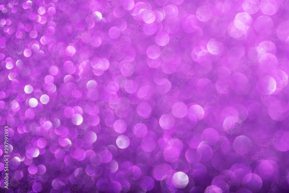 Shiny purple defocused glitter background.