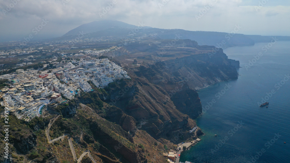 Aerial drone photo of Fira main village of Santorini island with breathtaking views to Caldera and Aegean sea, Cyclades, Greece