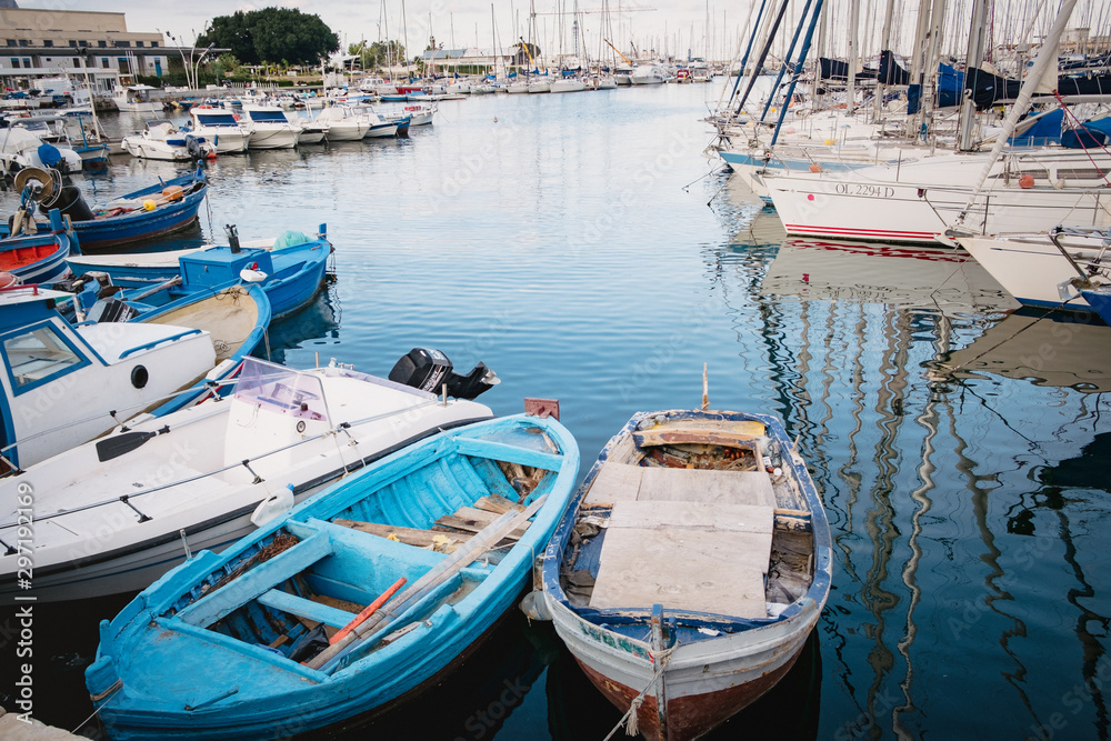 Seascape with fishing boats on the old port in Palermo, Sicily - in Italy Seascape with fishing boats on the old port in Palermo, Sicily - in Italy