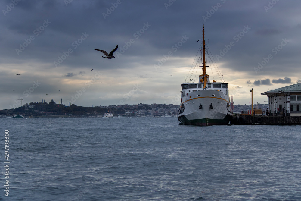 In Istanbul, ferries operate on the Bosphorus line. Traditional old steamers. Cloud weather in the background.