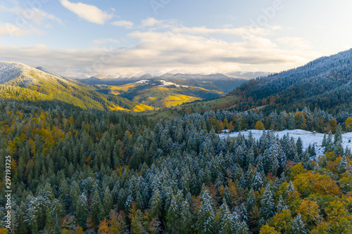 AERIAL: Flight Over Foggy Autumn Colourful Forests.
