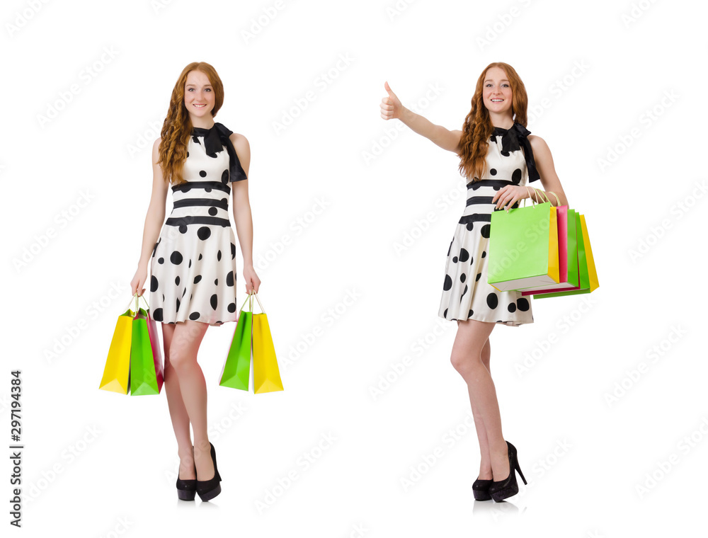 Young woman with shopping bags on white