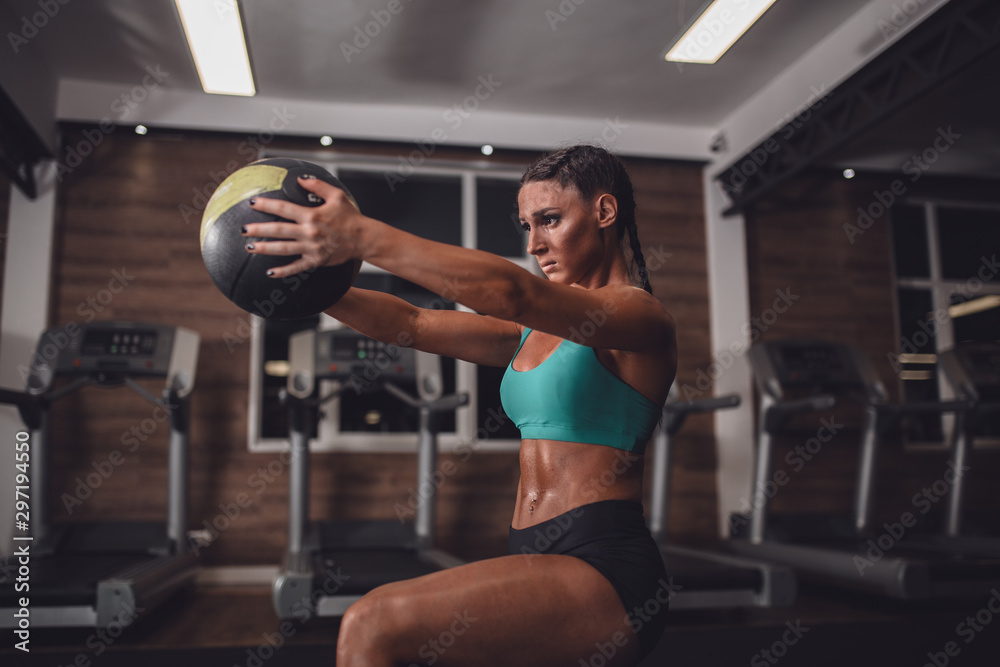 Fit girl in the gym with medicine ball Fit girl in the gym with medicine ball
