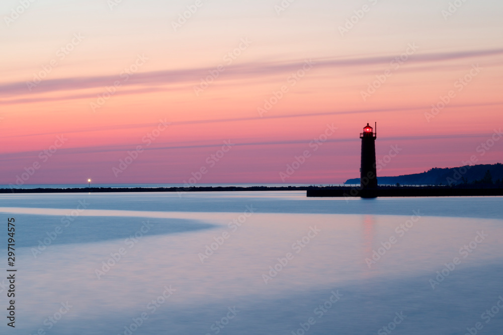 pastel colored sky with lighthouse at sunset