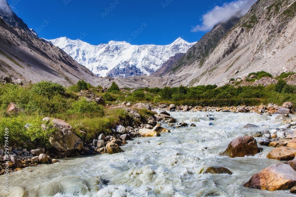 The peaks of the Main Caucasian Range on the background of the Bezengi glacier and the glacial landscape.