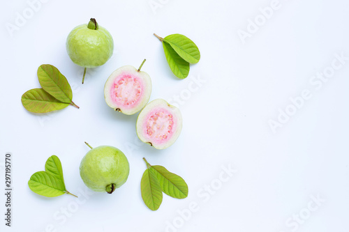 Fototapeta Naklejka Na Ścianę i Meble -  Fresh ripe guava and slices with leaves. Top view