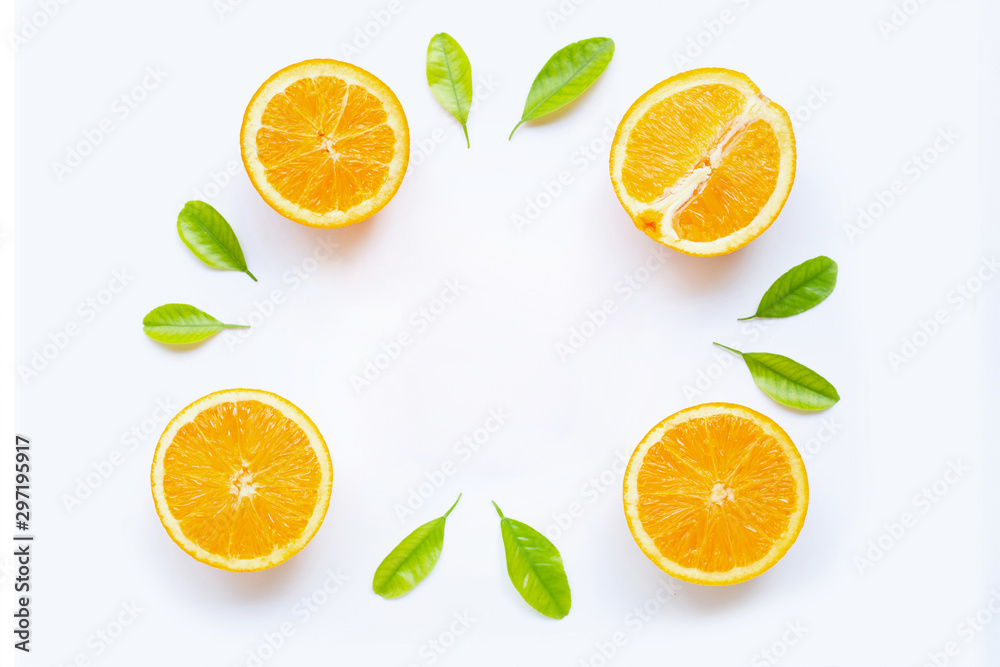 Frame made of fresh orange fruit with green leaves on white Frame made of fresh orange fruit with green leaves on white