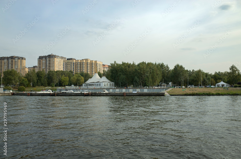 Moscow, Russia - September 8, 2018: Khimka River, Moscow Canal. Embankment Dolgoprudny. Residential buildings near the river