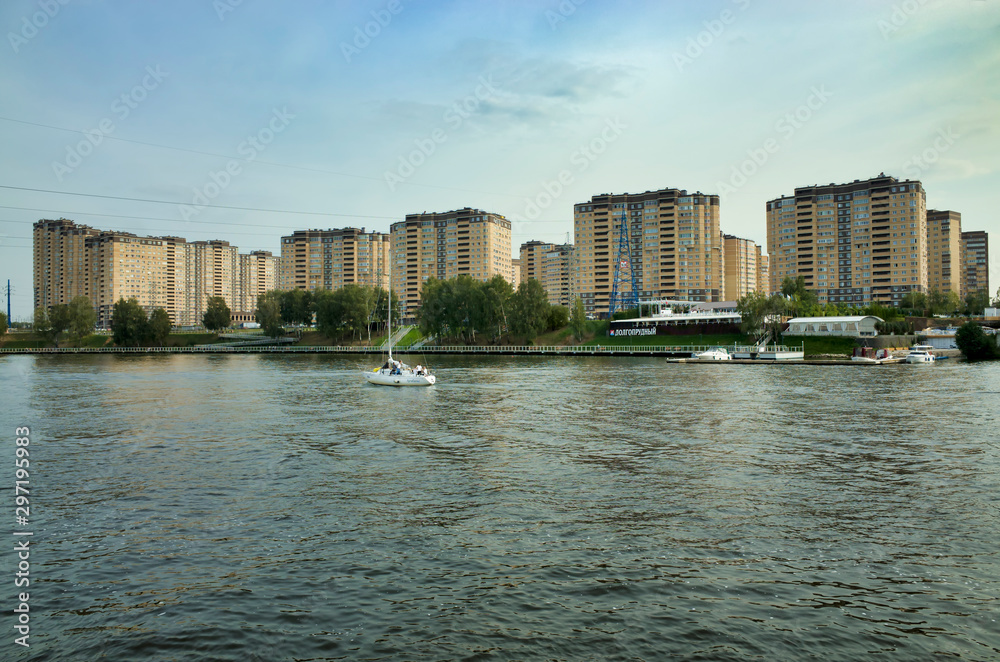 Moscow, Russia - September 8, 2018: Khimka River, Moscow Canal. Embankment Dolgoprudny. Residential buildings near the river
