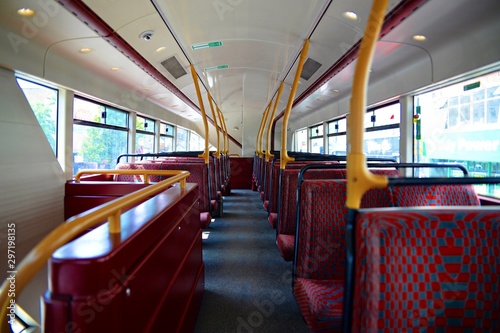 Photography Empty seats on a double-decker red bus with no passengers in London, England