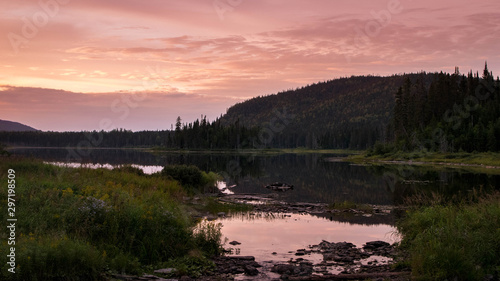 beautiful sunset with a lake and color reflection