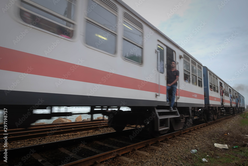 The picture of effect motion blurred, People on a train. Colombo, Sri Lanka The picture of effect motion blurred, People on a train. Colombo, Sri Lanka