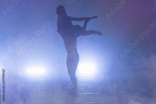 Two Young modern dancers dancing in the studio. Sport, dancing and urban culture concept. Group of young dancers performing on the stage. Effective performance. full of energe dancers.