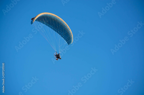 Paraglider in the blue skies