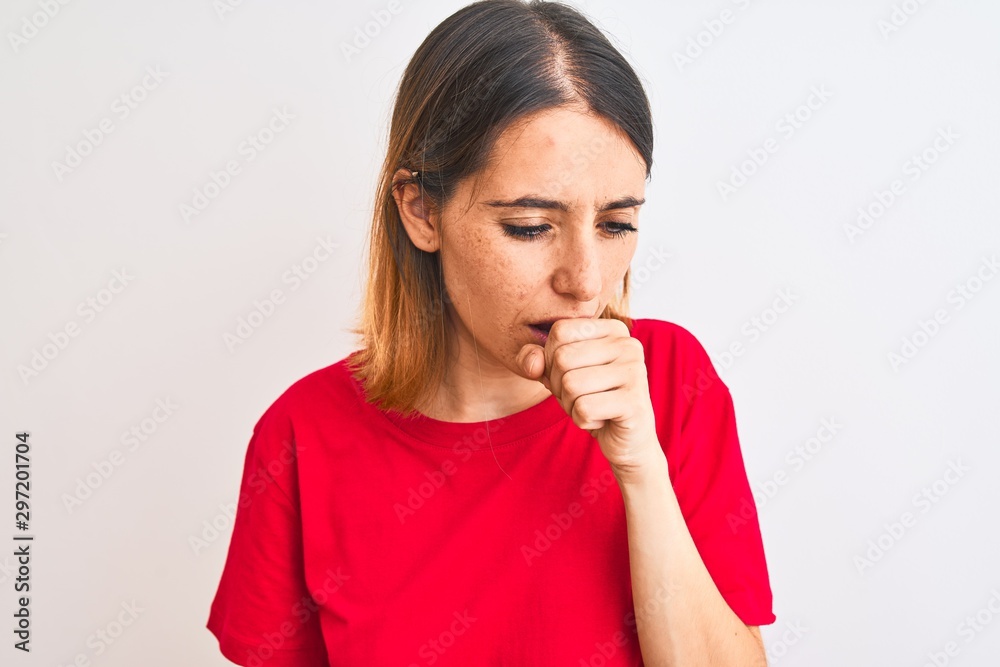 Beautiful redhead woman wearing casual red t-shirt over isolated background feeling unwell and coughing as symptom for cold or bronchitis. Healthcare concept. Beautiful redhead woman wearing casual red t-shirt over isolated background feeling unwell and coughing as symptom for cold or bronchitis. Healthcare concept.