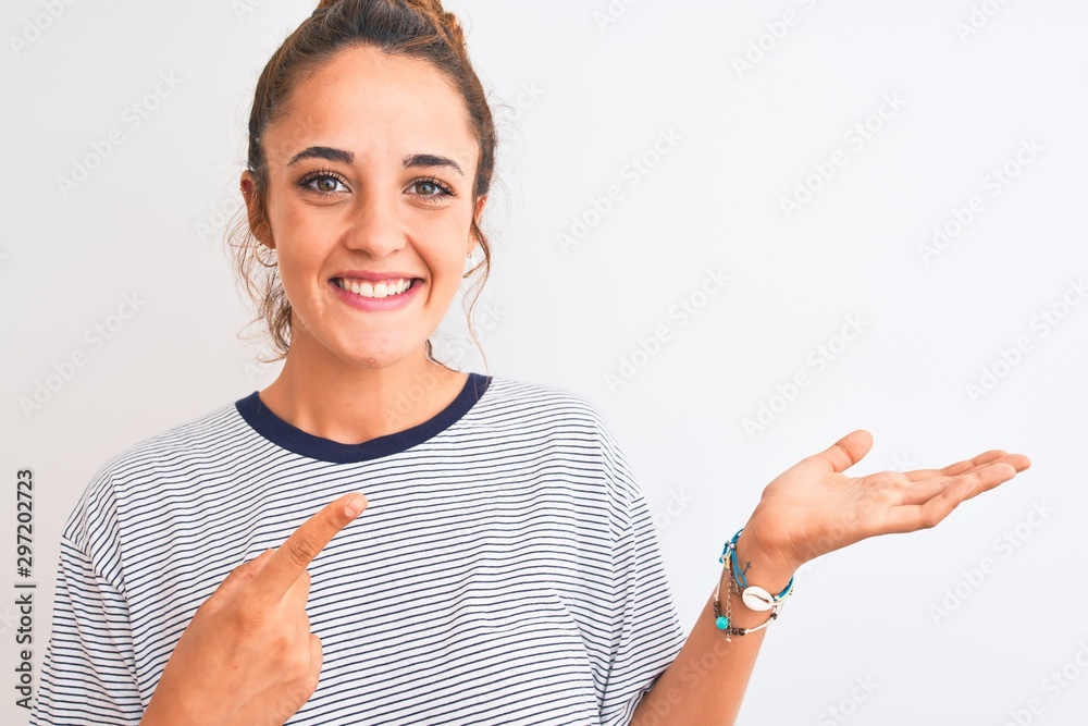 Young redhead modern woman wearing a bun over isolated background very happy pointing with hand and finger Young redhead modern woman wearing a bun over isolated background very happy pointing with hand and finger
