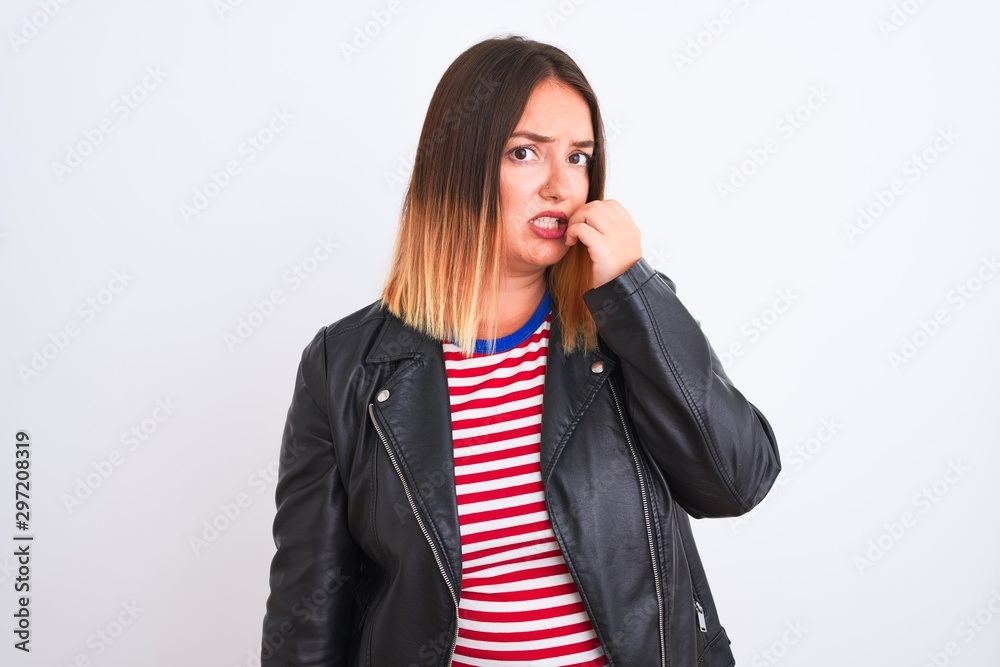 Young beautiful woman wearing striped shirt and jacket over isolated white background looking stressed and nervous with hands on mouth biting nails. Anxiety problem. Young beautiful woman wearing striped shirt and jacket over isolated white background looking stressed and nervous with hands on mouth biting nails. Anxiety problem.