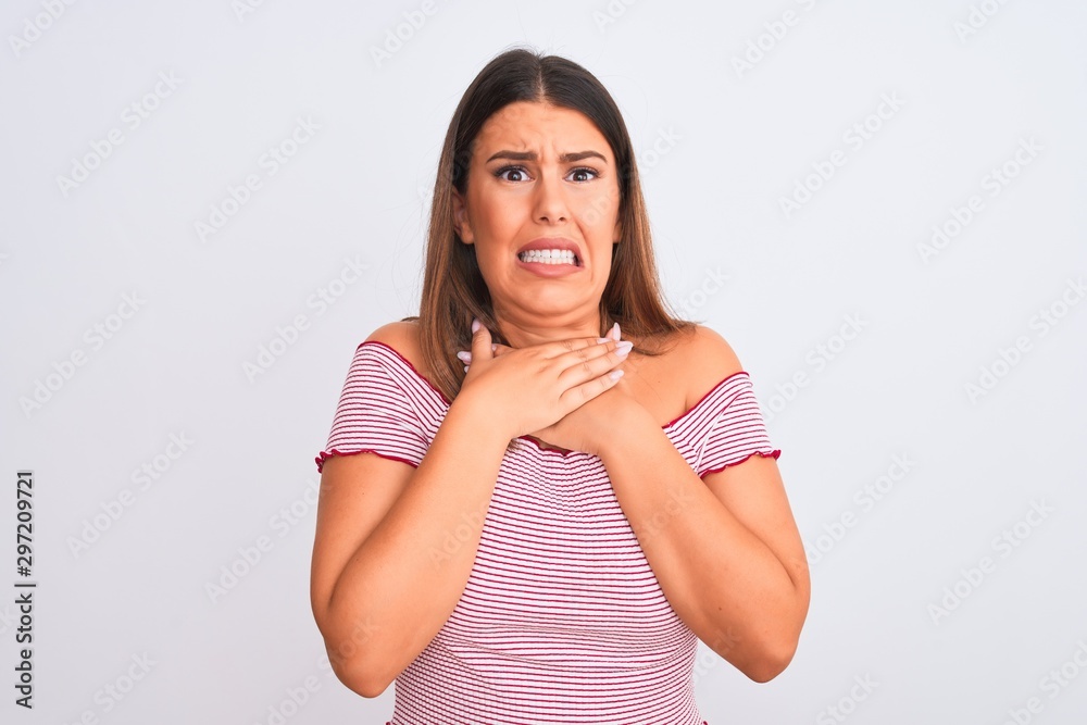 Portrait of beautiful young woman standing over isolated white background shouting and suffocate because painful strangle. Health problem. Asphyxiate and suicide concept. Portrait of beautiful young woman standing over isolated white background shouting and suffocate because painful strangle. Health problem. Asphyxiate and suicide concept.