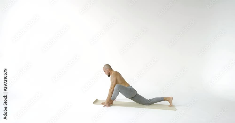 man changes low pose to adho mukha shvanasana slow motion man changes low pose to adho mukha shvanasana slow motion