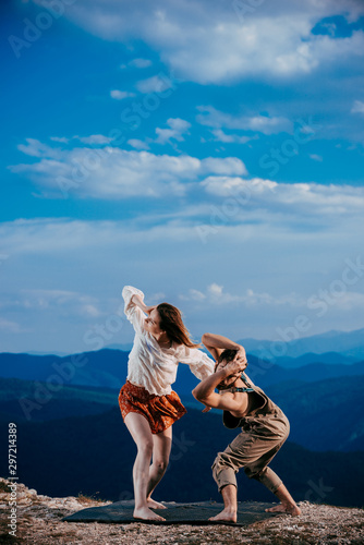 Acrobat pose of a two talented, young dancers exercise modern dance