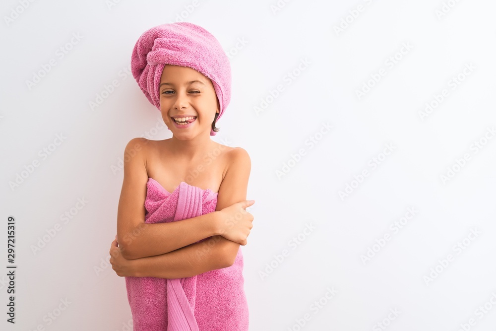 Beautiful child girl wearing shower towel after bath standing over isolated  white background winking looking at the camera with sexy expression,  cheerful and happy face. Stock Photo | Adobe Stock